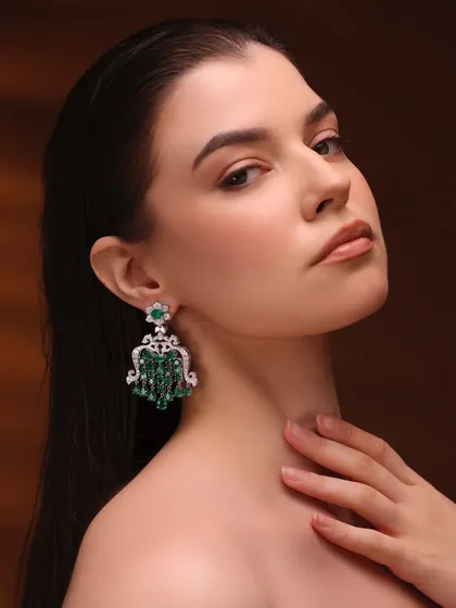 For this shot, the focus was on the stunning chandelier earrings. I kept the makeup very clean and minimal, with just a hint of definition on the eyes and a nude lip, allowing the jewelry to be the hero.