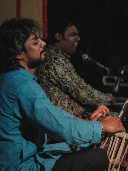 A focused, artistic shot of me playing tabla during a live performance.