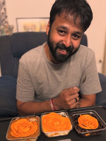 It's wonderful to see our desserts being a part of your special moments. This happy customer is enjoying a trio of our fresh mango dessert tubs.