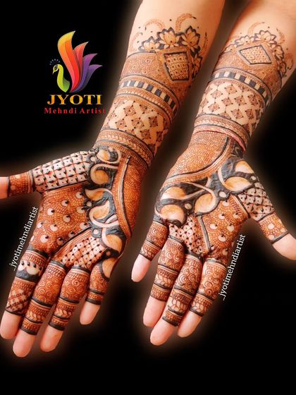 This design combines bold, dark-filled patterns with delicate, lighter work. The contrast makes the leaf and vine motifs stand out beautifully.