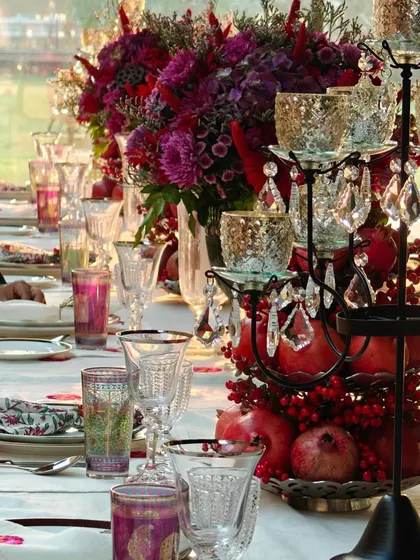 For this Diwali tablescape, I paired scarlet and burgundy flowers with pomegranates and crystal candelabras. The result is a rich, festive look that feels both traditional and incredibly luxurious.