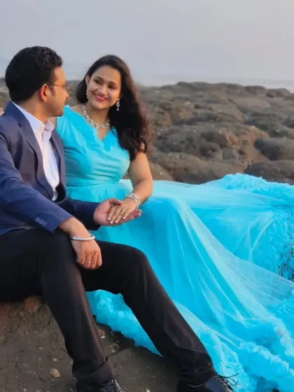 Our sky blue gown with a ruffled bottom trail adds a touch of soft romance to your pre-wedding photos on the beach.