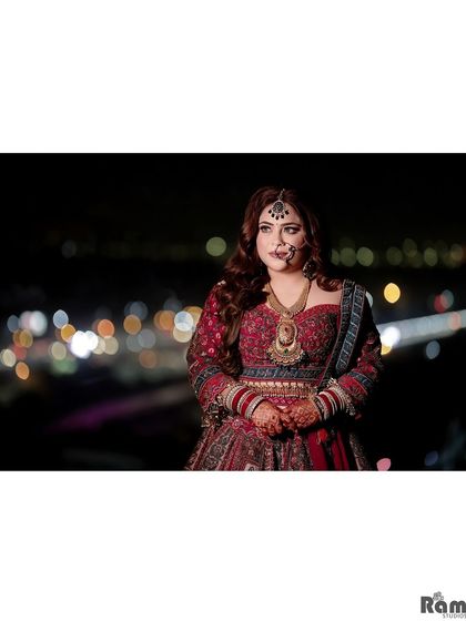 A stunning outdoor night portrait of the bride, with the blurred city lights creating a magical backdrop.