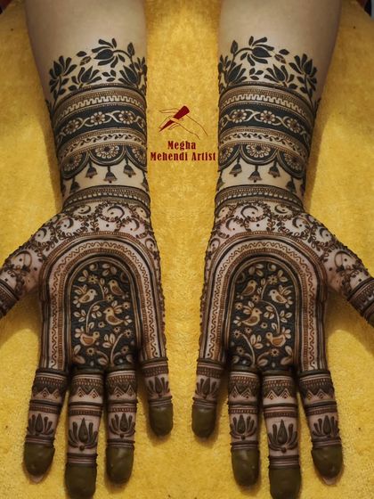 Inspired by royal architecture, this design features a beautiful jharokha (window) on the palm with lovebirds, creating a romantic and regal look.