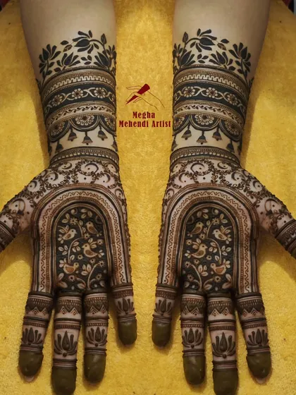 Inspired by royal architecture, this design features a beautiful jharokha (window) on the palm with lovebirds, creating a romantic and regal look.