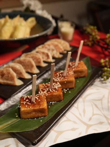 Another view of our popular catering appetizers, with the crispy Prawn Tempura visible in the background. We ensure every dish is presented with care, down to the last detail.