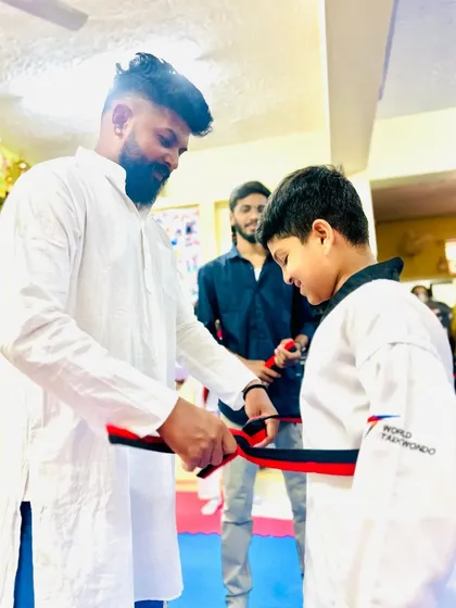 Another student achieves the rank of black belt.