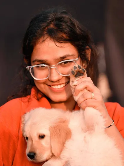 A tiny paw held in a loving hand. This is what it's all about. Moments like these with a new puppy are so fleeting, and I feel so lucky to be able to capture this simple, powerful gesture of connection. It’s a memory to hold onto forever.