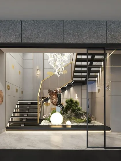 A modern staircase design featuring concrete panels with brass inlays. This combination of industrial chic and luxurious warmth creates a visually striking and one-of-a-kind look.