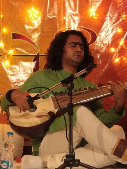 Sh. Arnab Bhattacharya lost in the melody of his Sarod, a moment of pure musical expression.