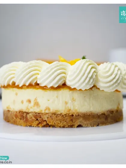 My Mango Cheesecake is a seasonal favorite. It features a buttery biscuit base, a rich and creamy cheesecake filling, and is topped with a sweet mango glaze and fresh cream swirls.