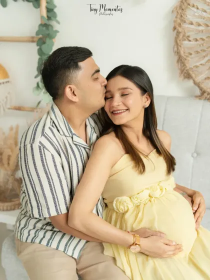 The quiet moments between partners are pure magic. In my natural light studio, I create a relaxed space for you to connect, allowing me to capture the authentic love that surrounds your growing family.
