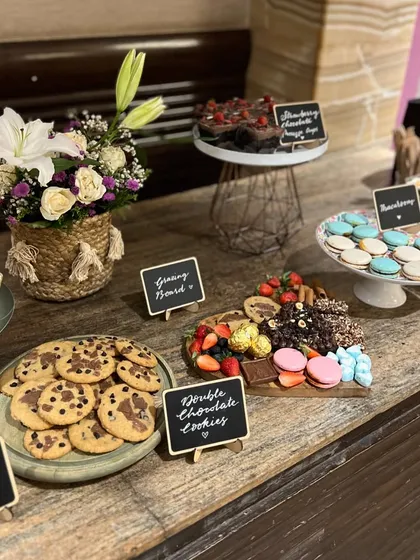 I also create dessert grazing boards for parties and events. This one features a custom assortment of my bestsellers, including brownie bites, double chocolate cookies, macarons, and a strawberry orange mousse cake.