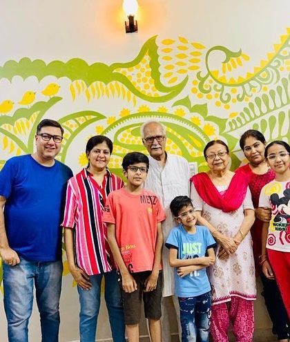 The wonderful Kapoor family with their 'Harmony' mural in Bahadurgarh. This piece is an ode to their joint family culture, with each element symbolizing their unity and love.