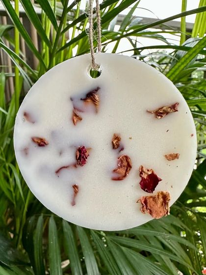 My rose-scented wax tablet, embedded with real rose petals. You can hang this in your wardrobe or place it in a drawer to keep your linens smelling divine.