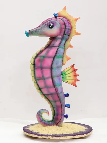 Another angle of the beautiful, edible seahorse sculpture, standing on a base of edible sand.