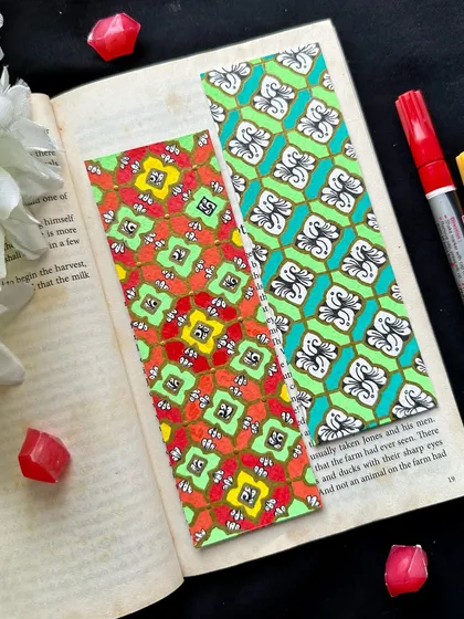 A pair of bookmarks with lively patterns and colors. The one on the left uses a bright red, yellow, and green combination, while the one on the right features a cooler palette of green and teal.