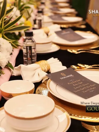 Where elegance meets gourmet. A close-up of our formal dining setup, showing the harmony between the floral centerpieces, the fine china, and the personalized menu cards.
