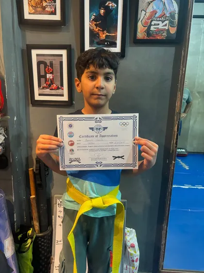 It all starts with the first step. This young champion just cleared his Level One kickboxing exam and earned his yellow belt. We build discipline and confidence from a young age.