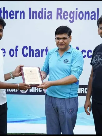 Receiving a certificate of appreciation from the Northern India Regional Council of the Institute of Chartered Accountants (ICAI) for conducting a yoga session.