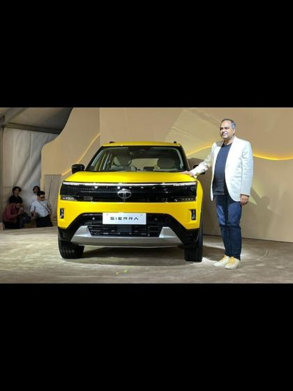 A key stakeholder poses with the new TATA Sierra. We facilitate these important photo moments for our clients.