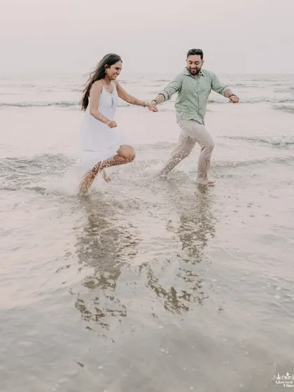Pure, unscripted joy as a couple runs through the waves at a Nashik beach. We love capturing these carefree moments where you can forget the camera and just enjoy being together.