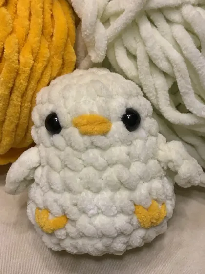This little duck amigurumi is made with fluffy white yarn and has the sweetest lil' face. He looks even better in person, I promise!