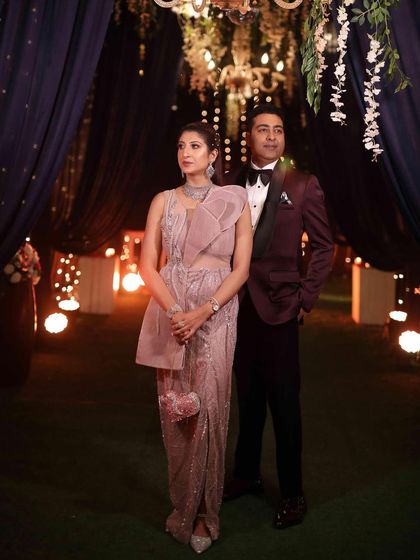 A candid moment from a reception party. My makeup was designed to look elegant in the evening ambiance, with soft glam that complemented my dusty pink saree.