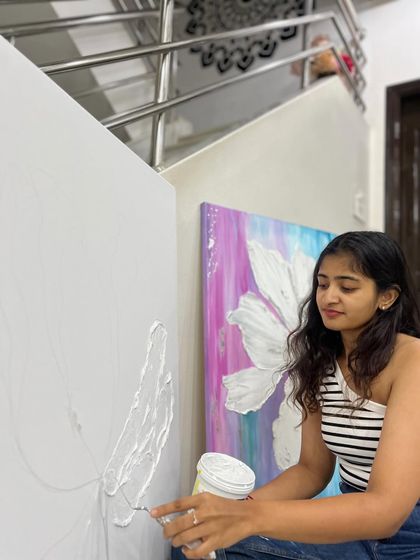 Casually painting and singing while working on my second textured floral canvas. The studio is my happy place, where I can freely play and create.