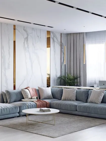 I designed this living room space to feel both luxurious and inviting. The centerpiece is a custom L-shaped sectional sofa in a soft, durable fabric, perfect for family gatherings. The clean lines of the sofa are balanced by plush cushions, creating a modern yet comfortable atmosphere that can be adapted to any contemporary home.