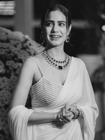 Another candid black and white shot, capturing a moment of genuine laughter and joy.