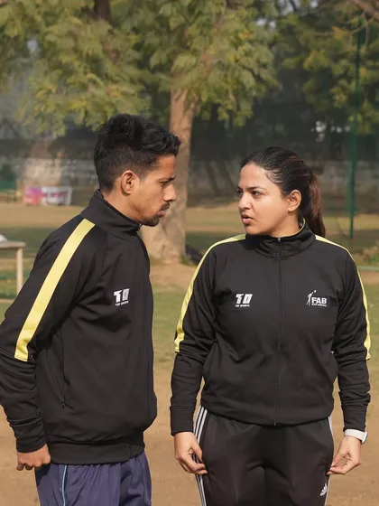 A discussion between two of our coaches. Coaching is the cornerstone of our mission, shaping character and instilling discipline in every young player.