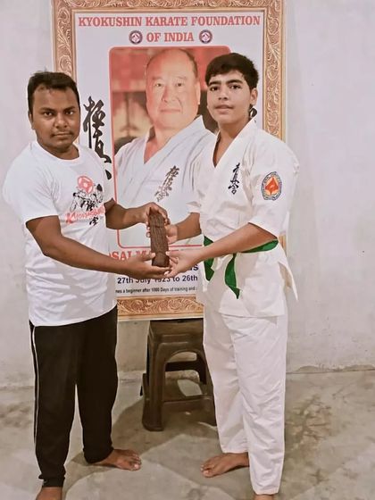 Awarding a belt is a moment of shared pride between the student and the instructor.