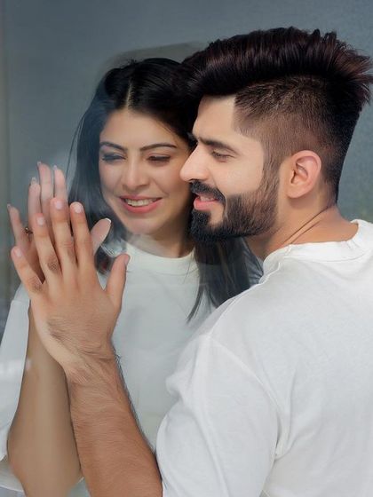 A tender moment shared through a window, creating a sense of intimacy and privacy. This type of shot allows for natural interaction, capturing the quiet love and comfort you find in each other.