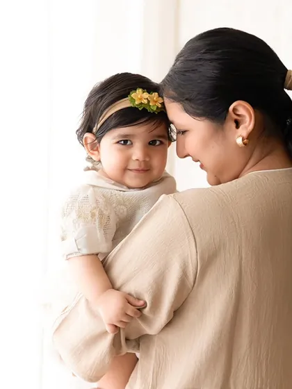 A tender mother and daughter portrait with soft, natural window light. This style of lighting creates a gentle and intimate mood.