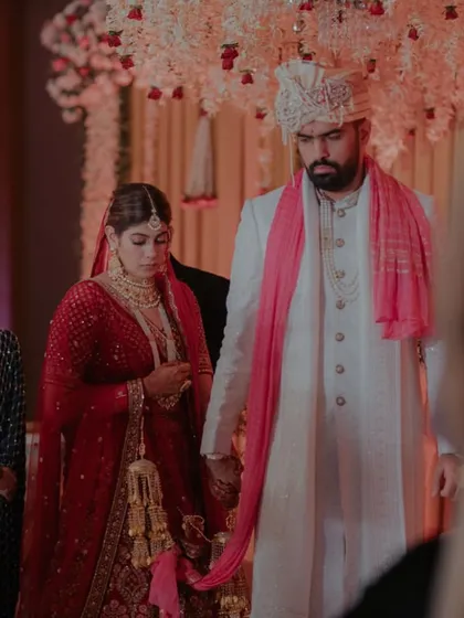 The couple taking their first steps as husband and wife during the 'saat phere'.