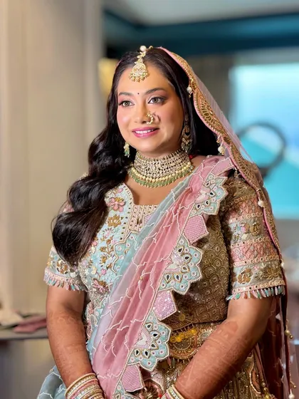 A happy and radiant bride, ready for her big day. The soft glam look enhances her natural beauty.