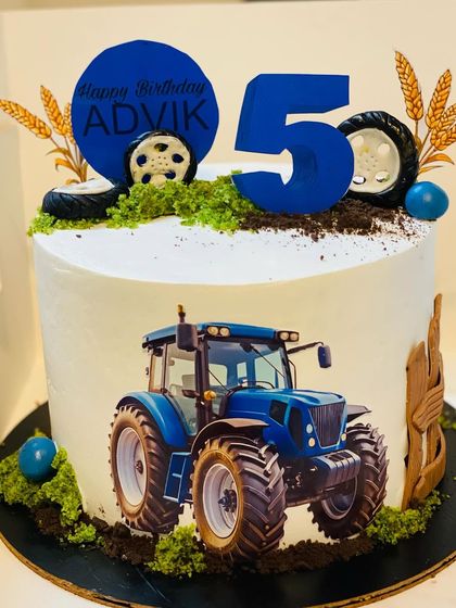 A unique tractor-themed cake for a 5-year-old, complete with edible soil and wheat stalks.