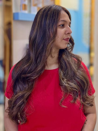 Our Toffee hair color obsession continues. These images display the rich, warm tones and seamless blending of our custom toffee shade on long, wavy hair.