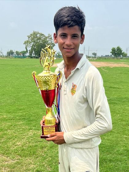 Piyush Neupane, the Man of the Series, holding the main trophy. His all-round performance was key to our victory.