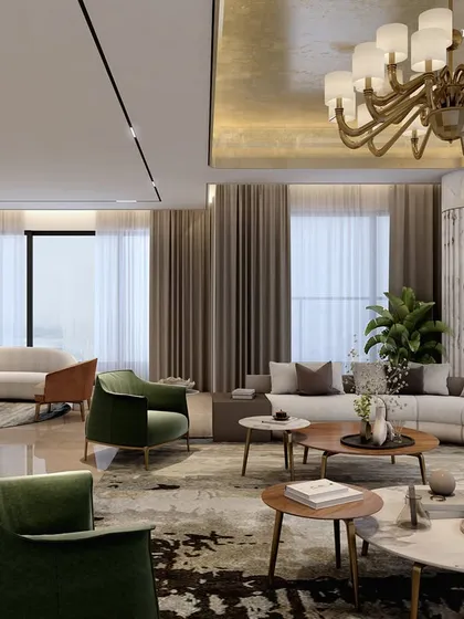 This living space in a Nagpur boutique apartment is framed in luxury, from the plush, curved interiors to the tranquil ambiance. A gold-leaf ceiling and a classic chandelier add a layer of opulence, while large windows invite natural light to gleam across the fine materials.