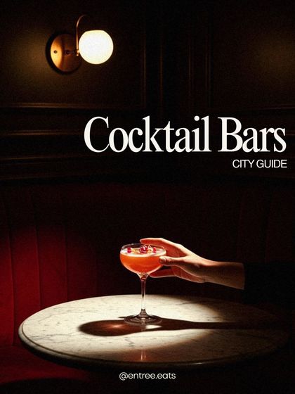 This "Cocktail Bars City Guide" cover is a masterpiece of mood. The single light source creates dramatic shadows, highlighting the hand holding the elegant coupe glass. It tells a story of a sophisticated night out.