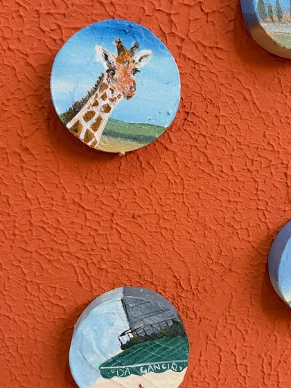 The magic is in the details. I absolutely love painting miniatures, like this little giraffe from a client's safari memory. This close-up shows the detail and texture I put into every tiny painting to make your stories feel real.