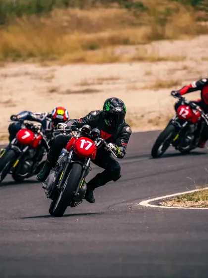 A group of riders cornering together during a training session. Our programs emphasize learning in a group setting, allowing riders to observe and push each other to improve.