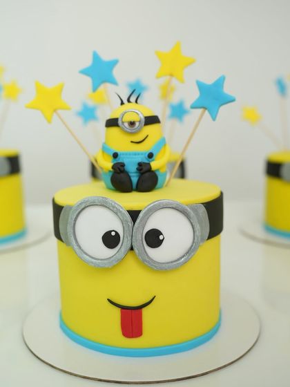A perfectly executed Minion-themed cake, made by one of our students. Notice the sharp edges, smooth fondant, and detailed character work, all techniques we cover in-depth in our advanced modules.