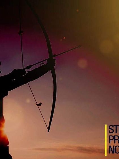 The classic silhouette of an archer against a warm light. This image captures the timeless appeal and grace of the sport.