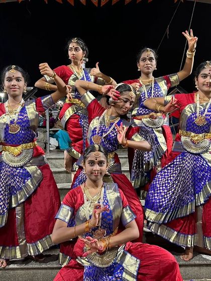 A playful pose from my students during a Navaratri performance. While we maintain discipline, we also encourage them to express their joy through dance.