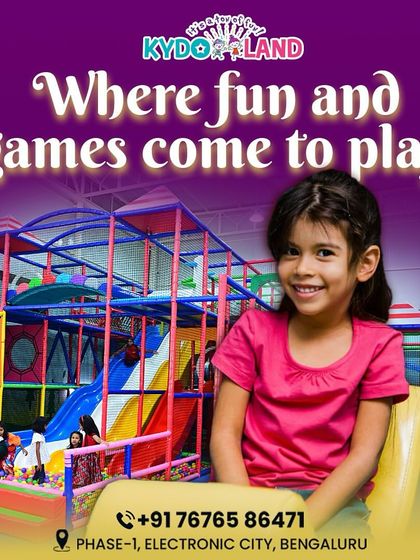 This is a place where fun and games truly come to play. This happy girl, sitting in front of our large play structure, is ready for a day of adventure.