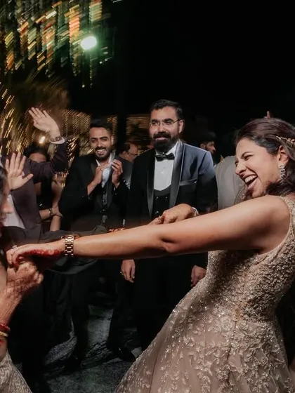 Nothing beats the energy of a packed dance floor. I love capturing the laughter and crazy moves as you and your friends celebrate. This shot from a Sangeet night shows the pure fun of dancing with your favorite people.