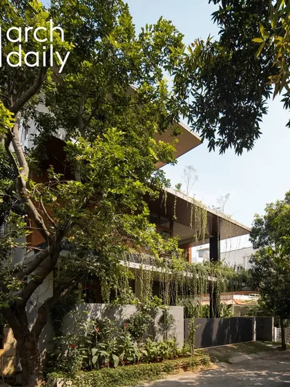 My goal is to create homes that are shrouded in green, not just surrounded by it. This exterior view of the "House of Greens" shows how we integrate planters and cascading greenery into the structure itself, making the landscape a living part of the architecture.